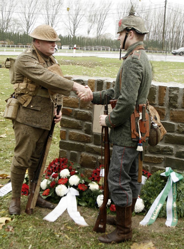 Descendants of Great War veterans shake hands at the unveiling a Christmas Truce memorial (Picture: Alan Cleaver).