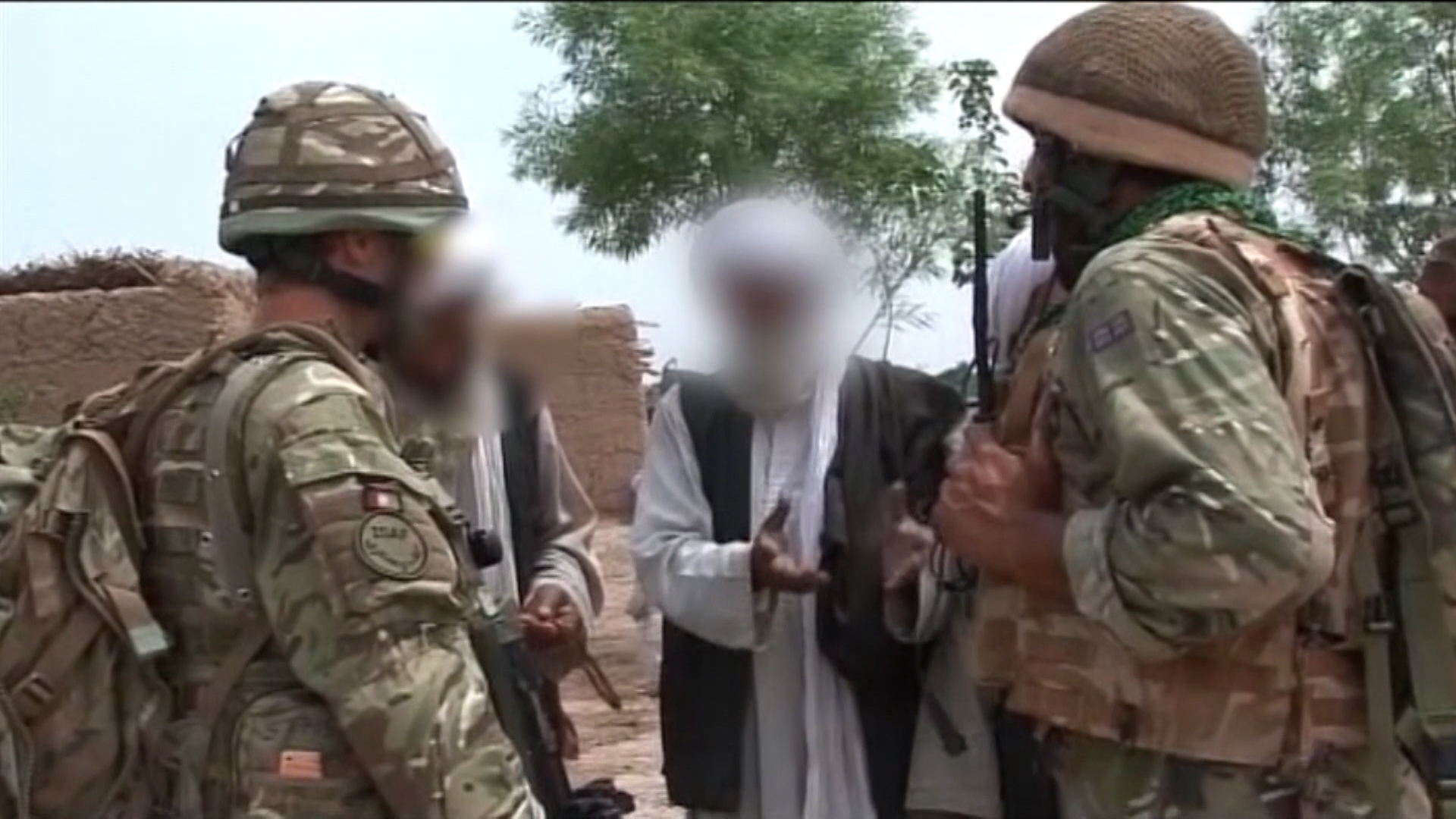 British troops with anonymous Afghans