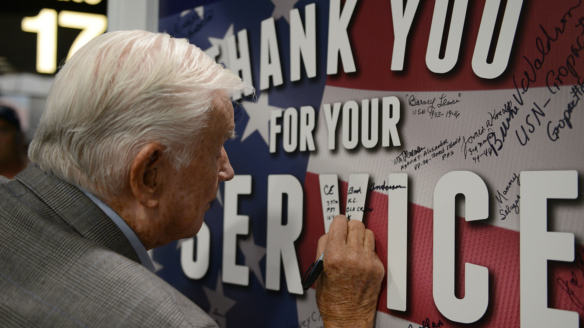 Brig Gen Anderson was based at the Sacramento Air Depot during the Japanese attack on Pearl Harbor on 7 December 1941, and returned to Hawaii to sign a remembrance poster in 2016 (Picture: US Department of Defense)