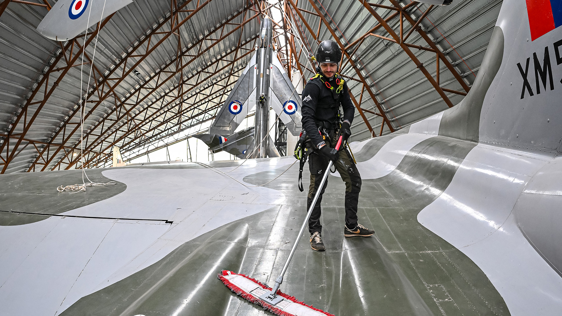 The team scaled the rafters of the building and dangled down to get to the aircraft (Picture: RAF Museum)