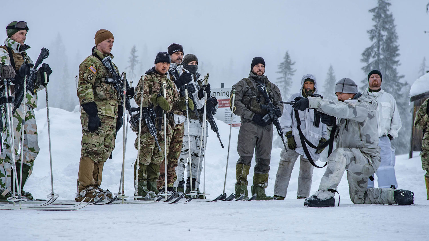 Cold weather operations training in Norway. A Norwegian instructor conducts a weapons demonstration to soldiers on skis CREDIT Nato