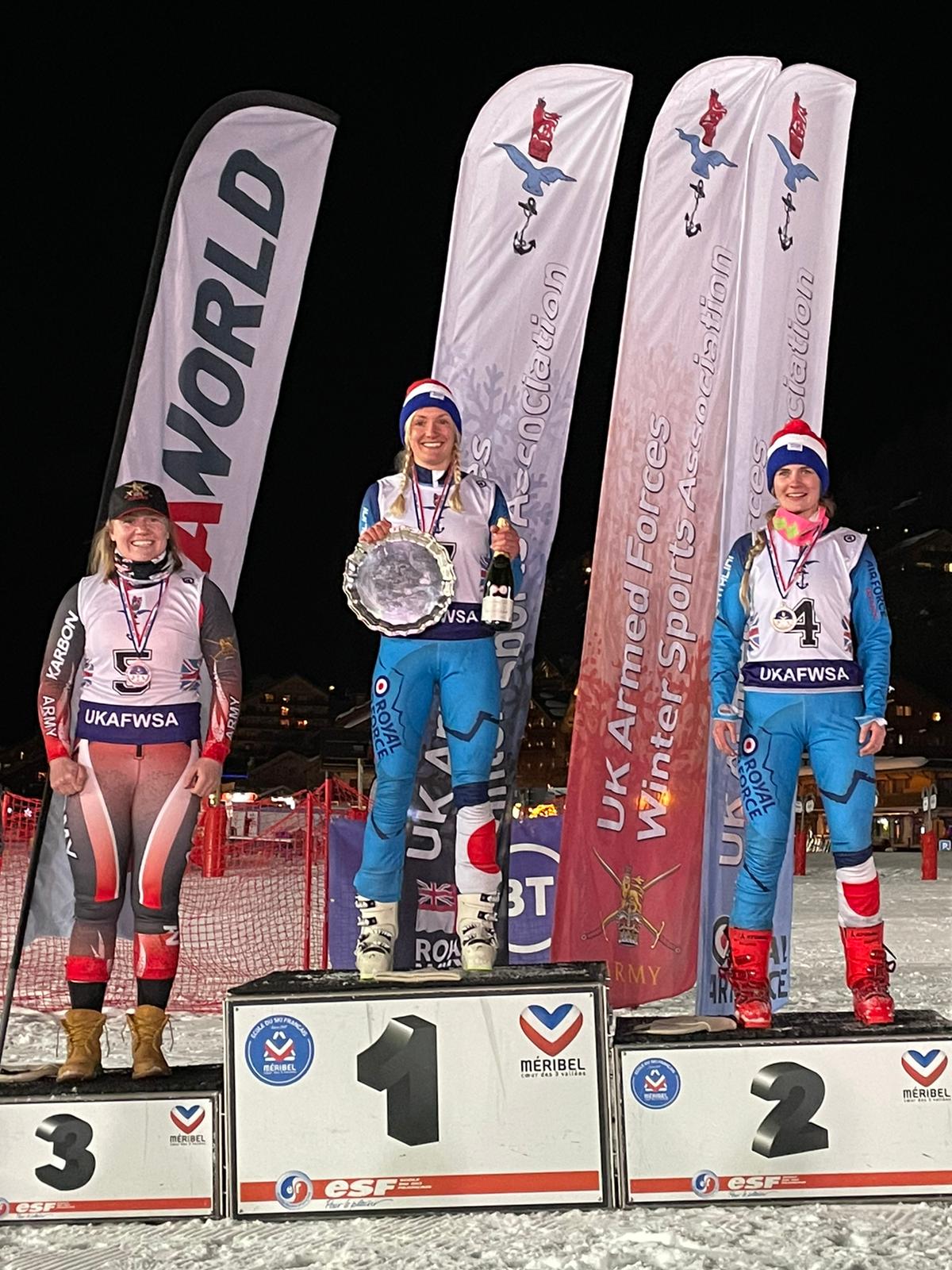 Colour Sergeant Lou Dodd, left, Corporal Rachel Hughes and SAC Winks Baxter, right, on the podium at the ISSSC in Meribel