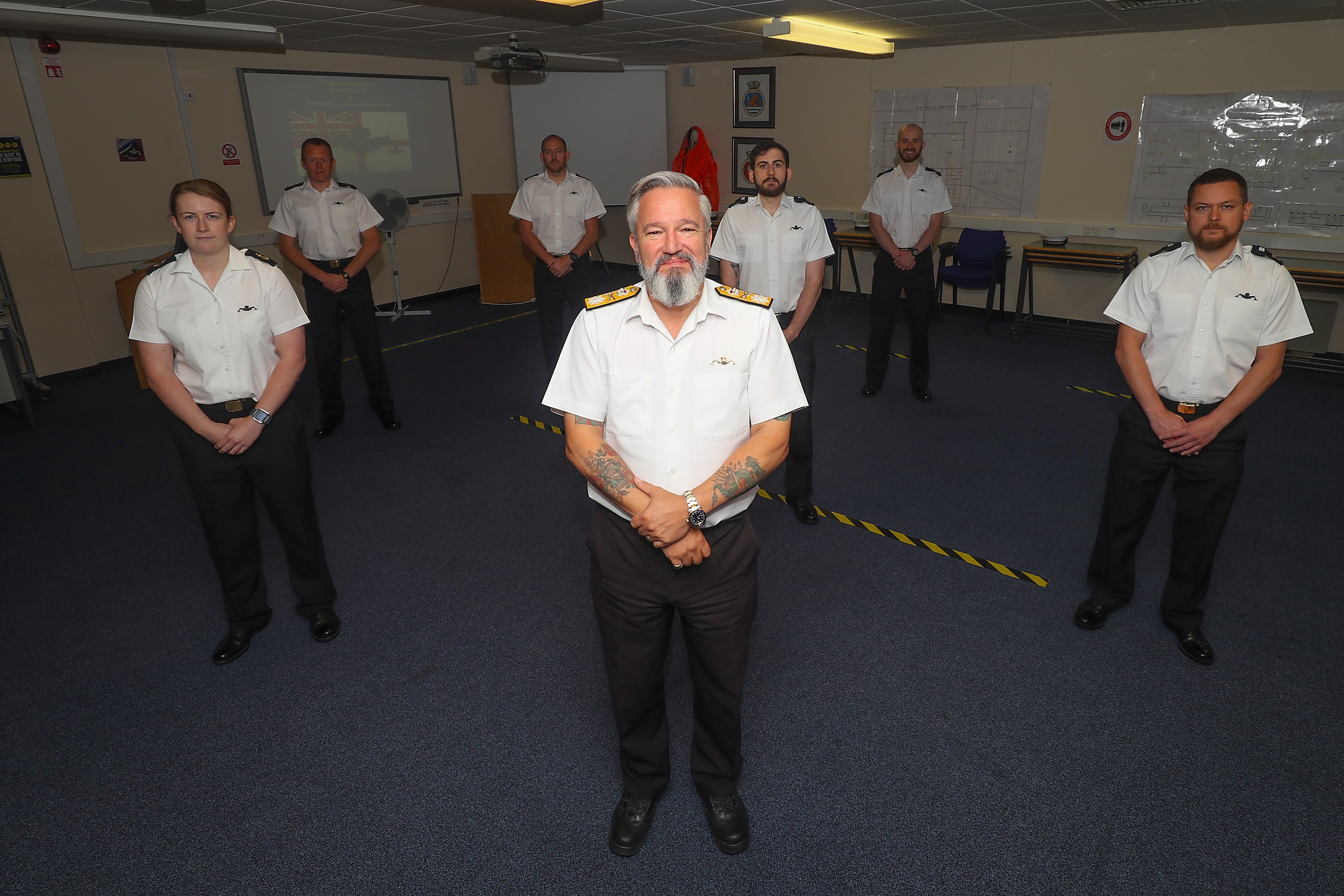 Commodore Jim Perks (centre), Head of the Royal Navy Submarine Service, presented the first set of students with the badge at HM Naval Base Clyde (Picture: Royal Navy).