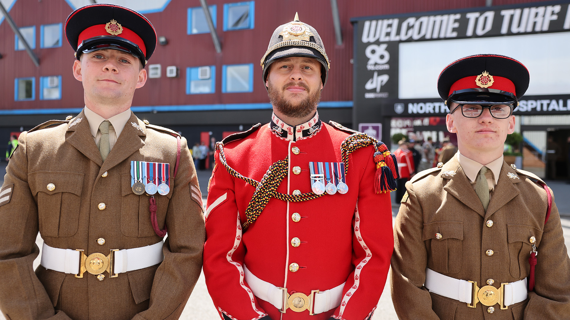 Corporal Conah Sagar, Lance Corporal John Galawan, and Kingsman Mason McCarney in their uniforms at the parade 