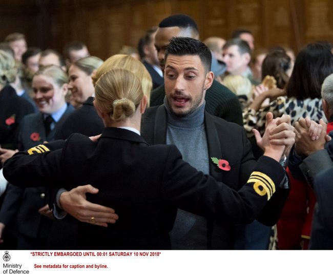 Contestant Giovanni Pernice dances with a member of the Royal Navy (Picture: MOD).