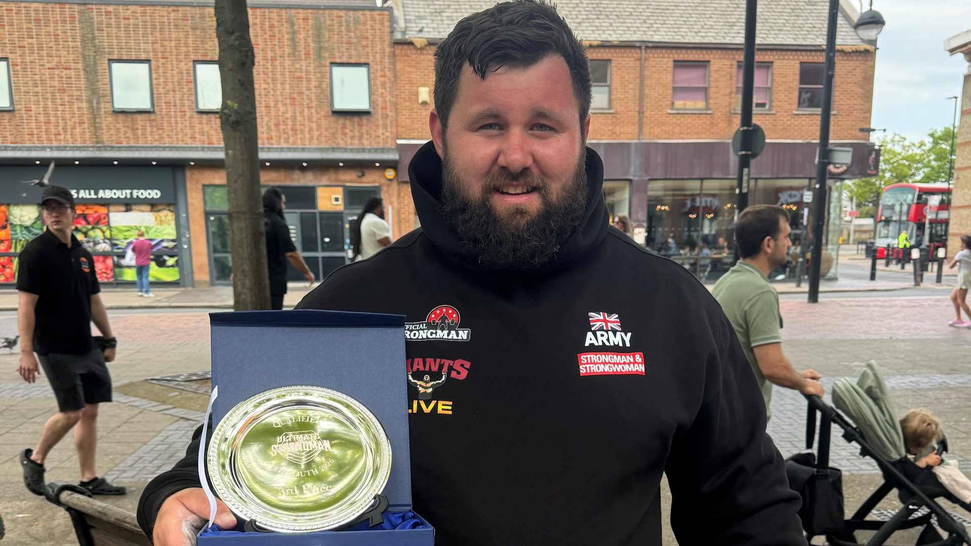 Corporal Rhys Calland of British Army with 3rd place trophy for Ultimate Strongman