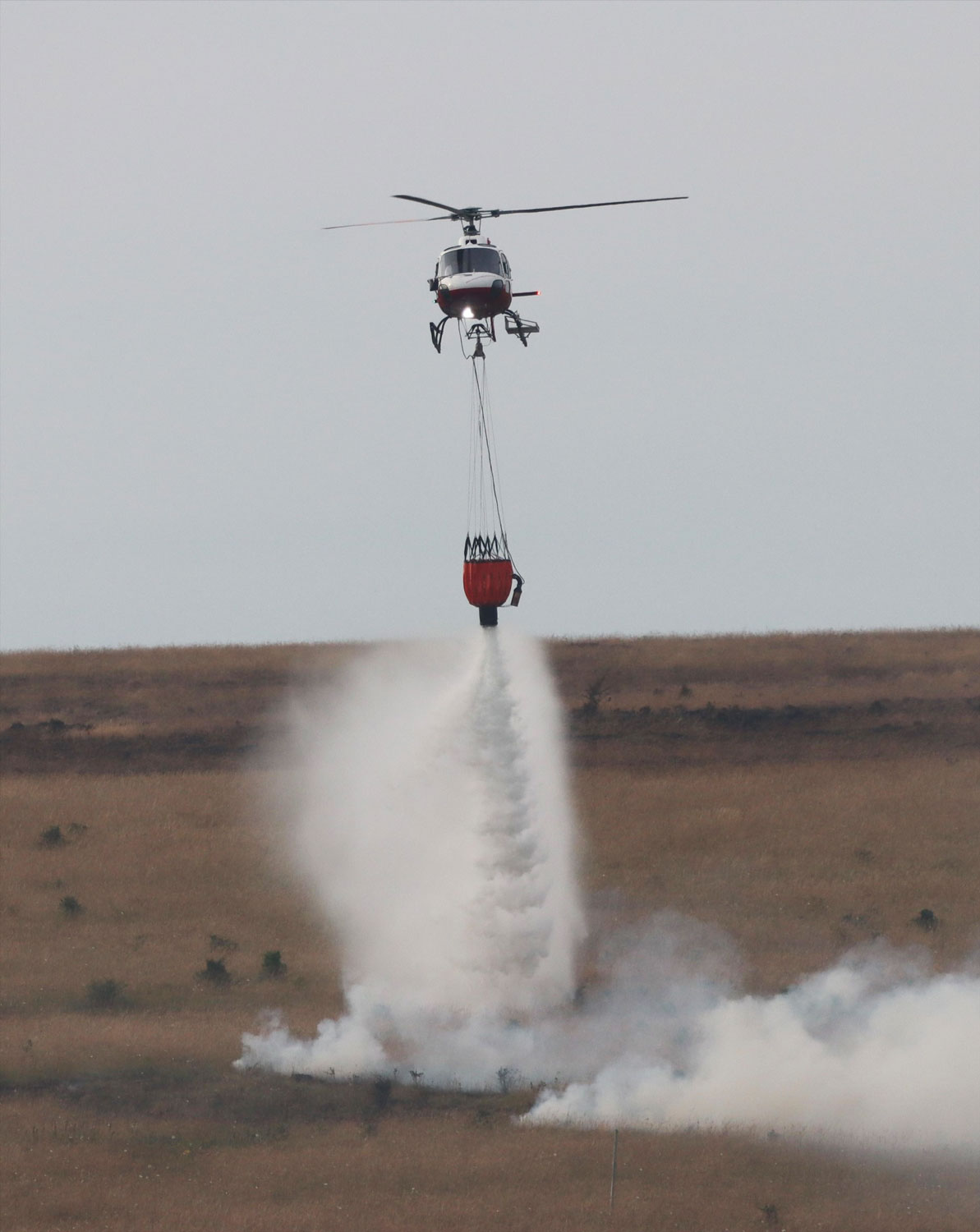 Salisbury Plain Training Area fires extinguished by helicopter dropping water on the areas affected CREDIT Tim Jalland