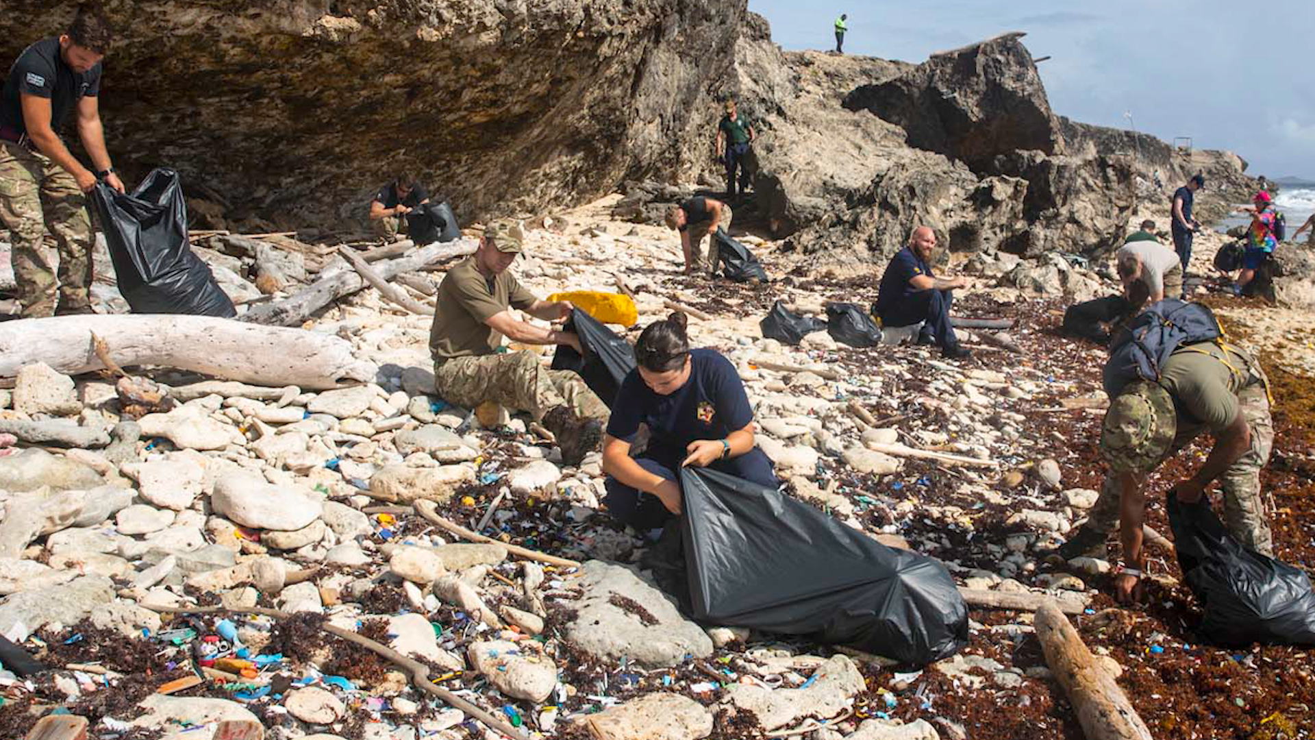 Crew members of RFA Argus help to remove plastic waste from a beach on the Dutch Caribbean island of Curaçao (Picture: Royal Navy).
