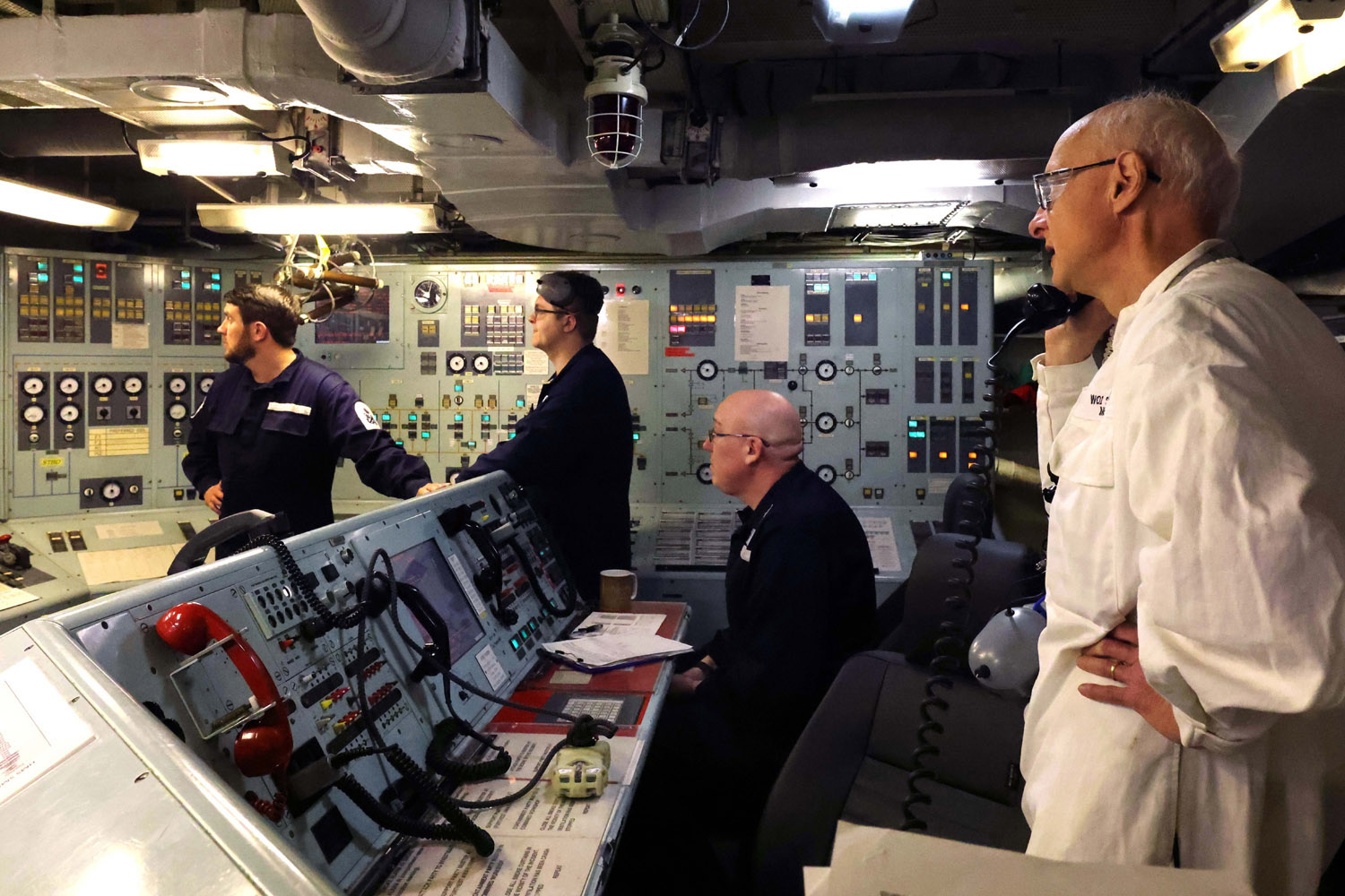 Royal Navy sailors in control room of ship
