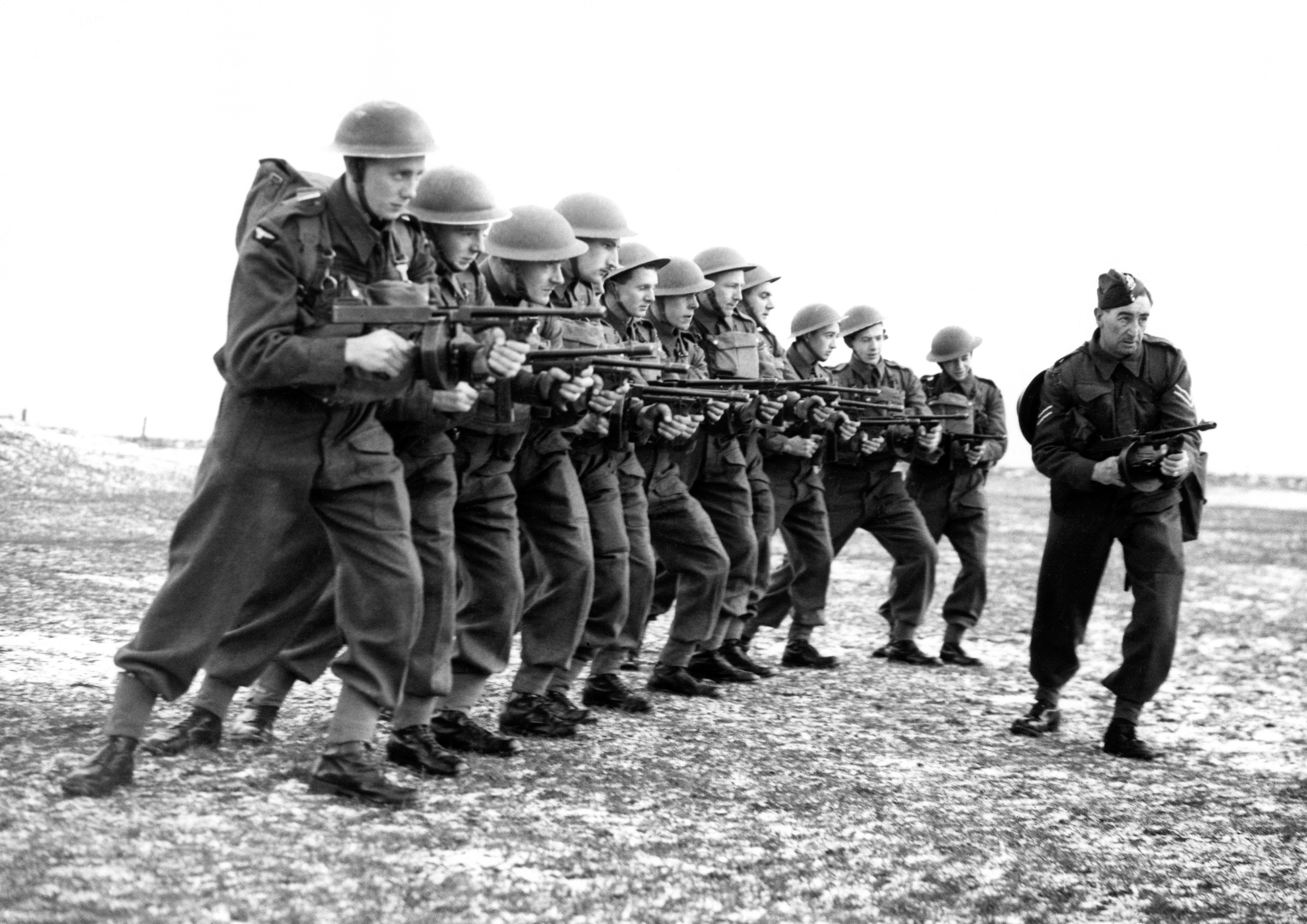 An Army instructor teaching men of the newly-formed RAF Aerodrome Defence Corps on the Thompson sub-machine gun