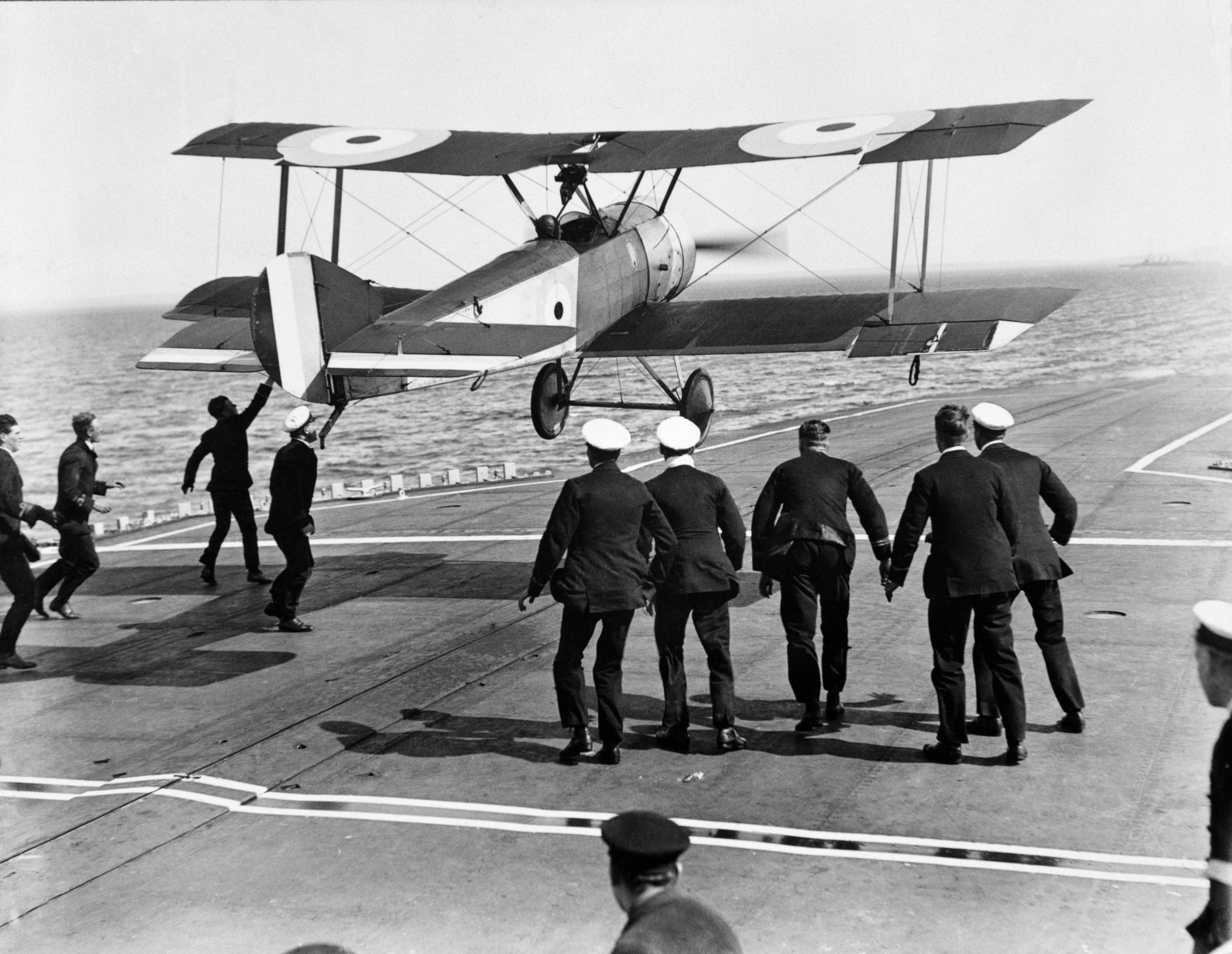 Crown Copyright Squadron Commander EH Dunning attempting to land his Sopwith Pup (N6453) on the flight deck of HMS Furious