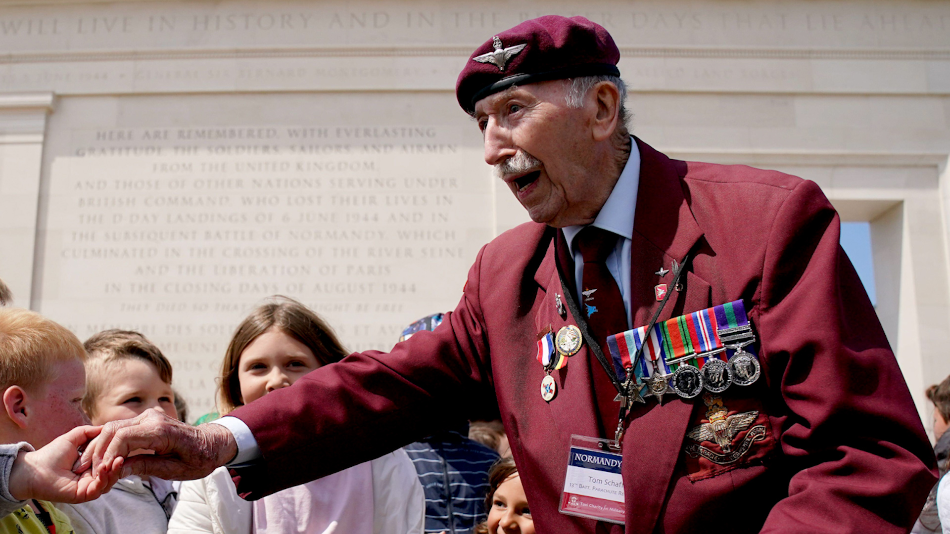 D-Day veteran Tom Schaffer 13th Battalion Parachute Regiment greets local French schoolchildren at the British Normandy Memorial Image ID 2R5TC7B 050623 CREDIT PA Images Alamy Stock Photo