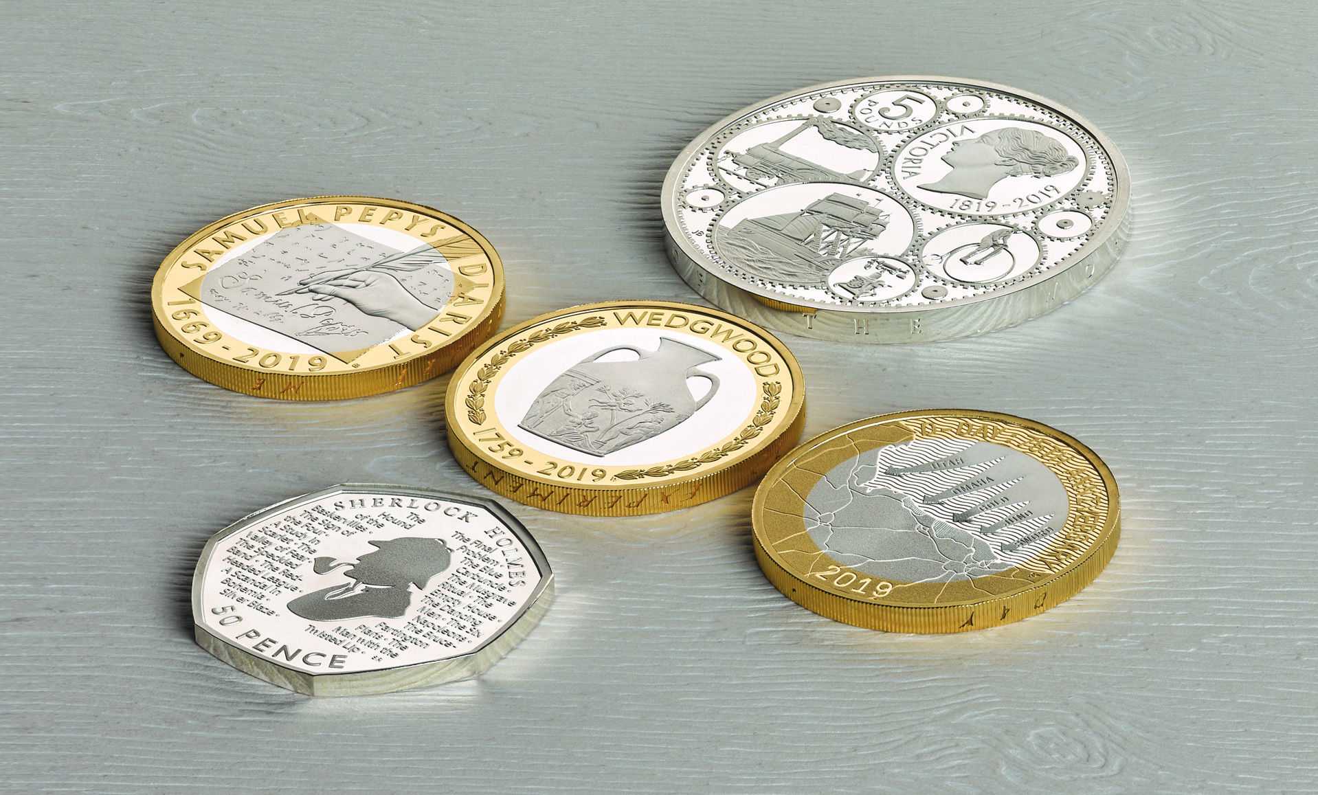 D-Day commemorative coin is pictured on the bottom right (Picture: The Royal Mint/PA).