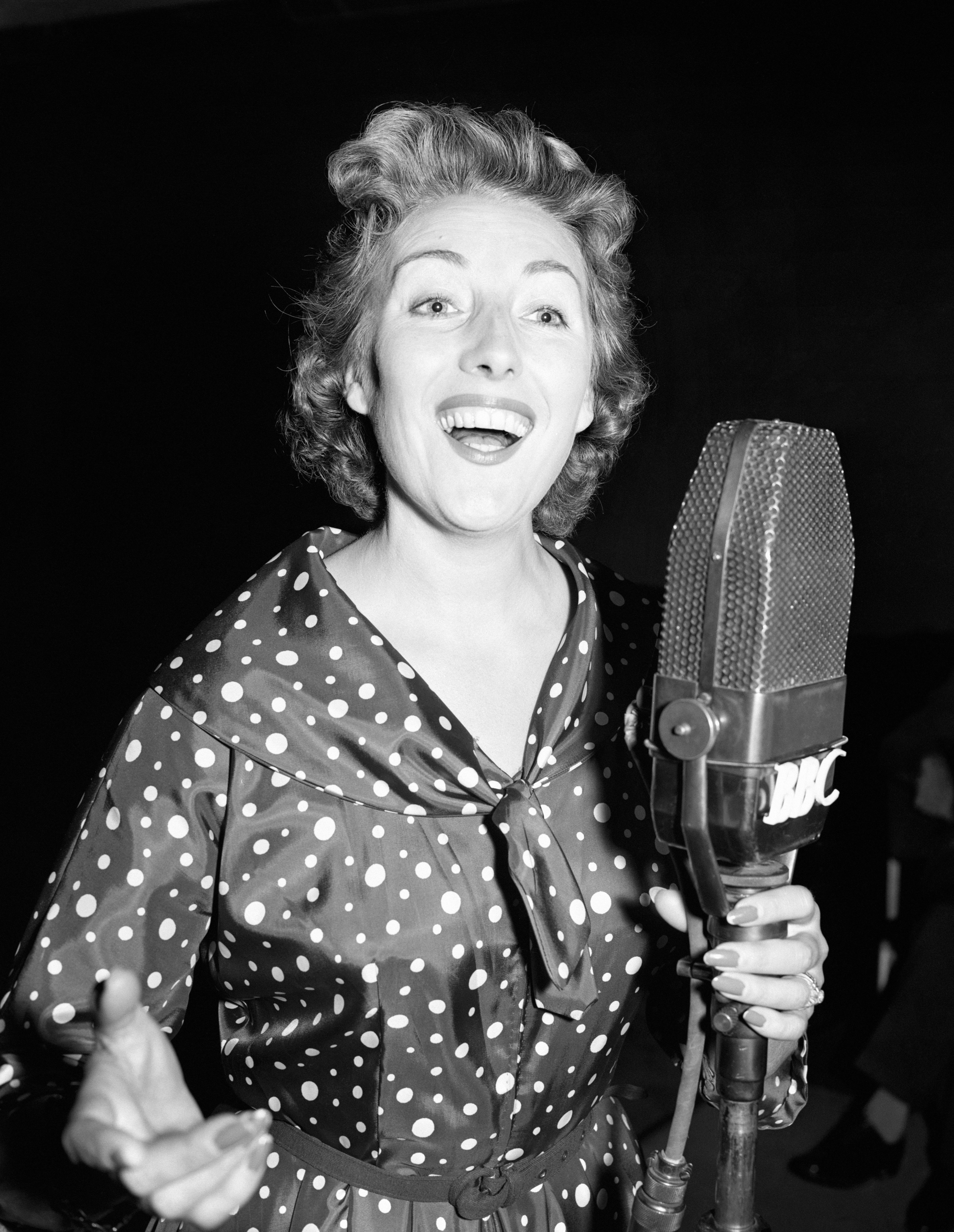 Dame Vera Lynn rehearsing at a microphone (Picture: PA Images).
