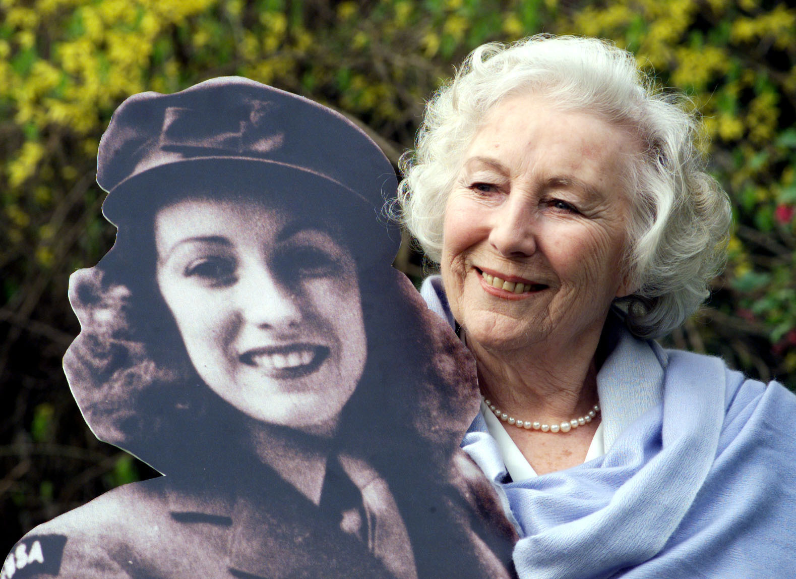 Dame Vera Lynn with life-size cutout of herself after being named personality of the century (Picture: PA).