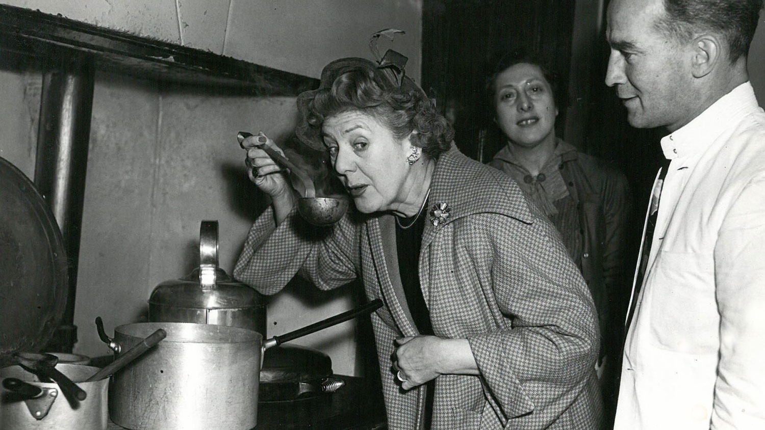 Dame Cicely Courtneidge sipping soup at the Embankment Fellowship Centre (Picture: Veterans Aid).