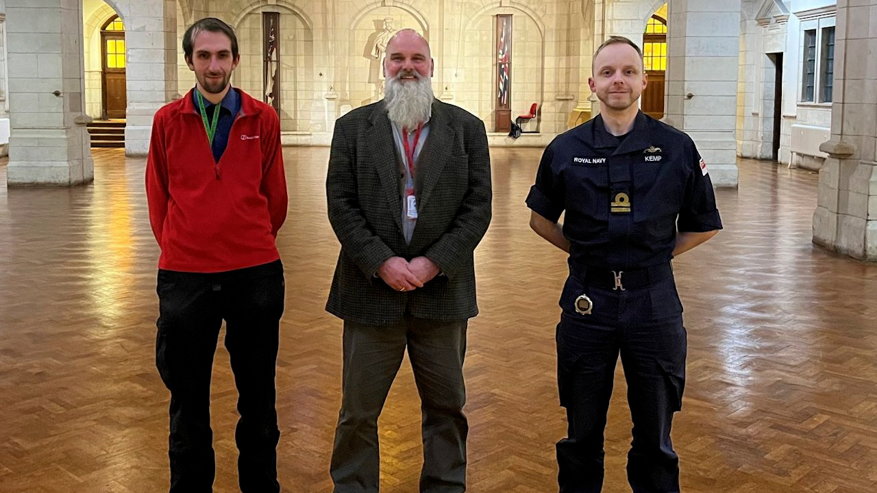 David Ashby and Simon Roffey with Lieutenant Thomas Kemp at nearby Britannia Royal Naval College (Picture: University of Winchester).