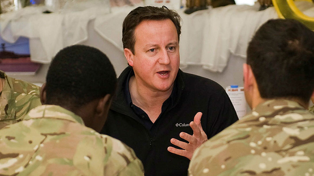Former Prime Minister David Cameron talking with troops at Camp Bastion during his visit to the Joint Operating Base in Afghanistan in December 2012 CREDIT Crown Copyright