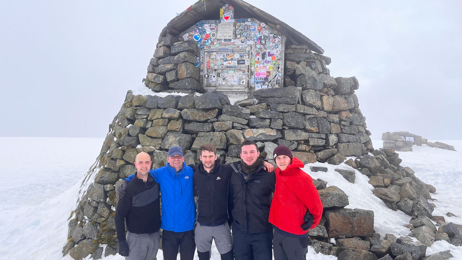 David Lynham, Ben Crowley, David's father and friends pictured at the emergency shelter at the top of Ben Nevis in Scotland CREDIT David Lynham