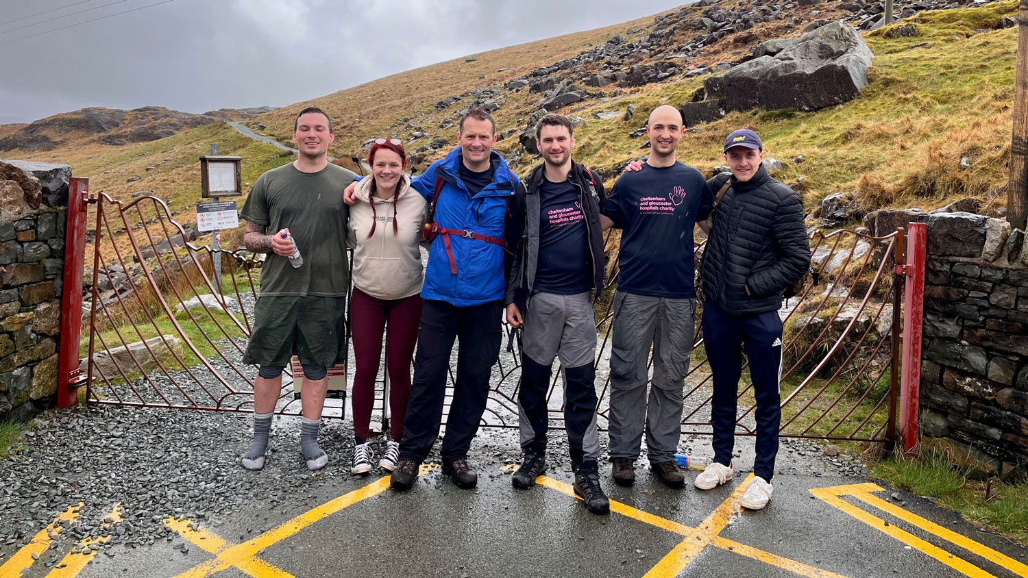 David-Lynham, Ben Crowley, David's father and friends pictured by gates at Snowdon in Wales CREDIT David Lynham