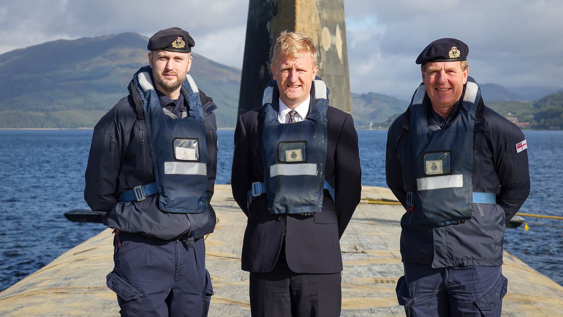 Deputy Prime Minister Oliver Dowden and First Sea Lord, Admiral Sir Ben Key on the Vanguard submarine as it arrives back at the Clyde Naval Base