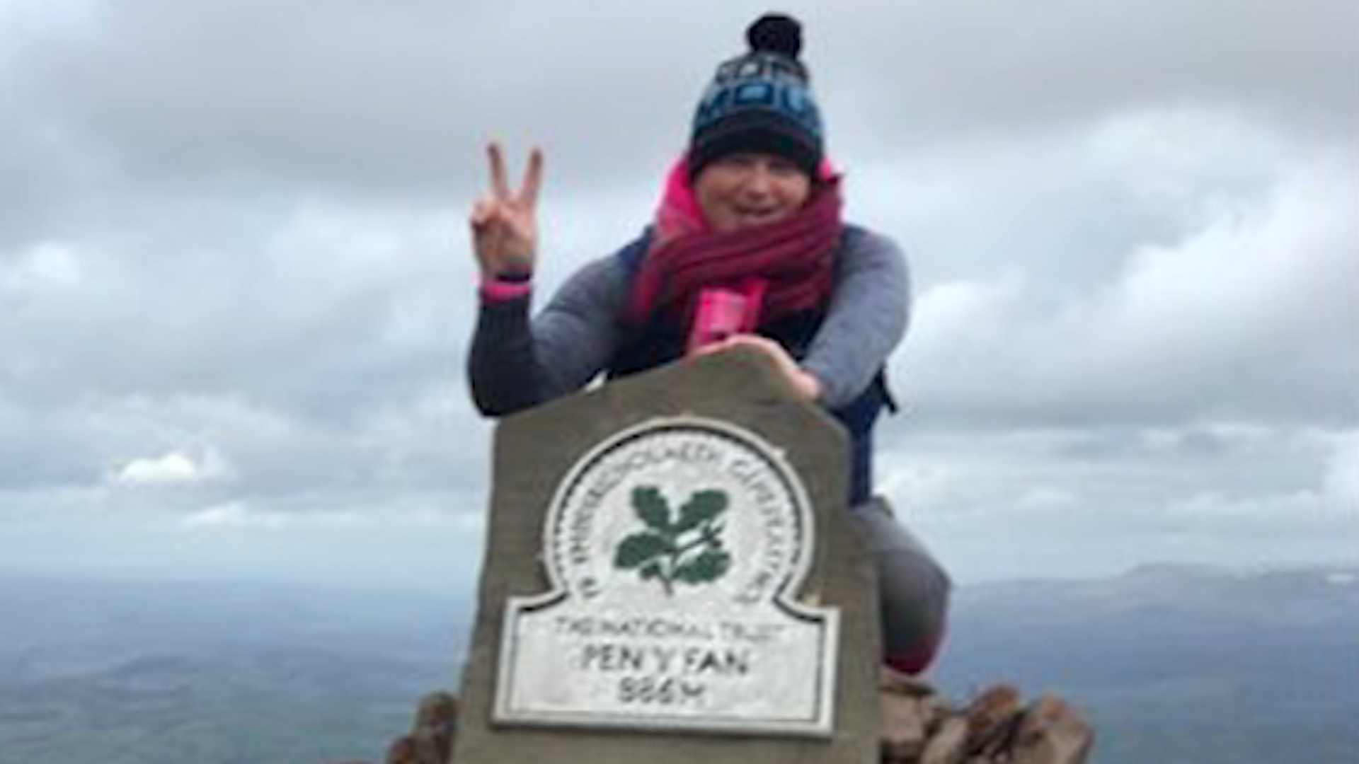Des Lally poses at the top of Pen y Fan