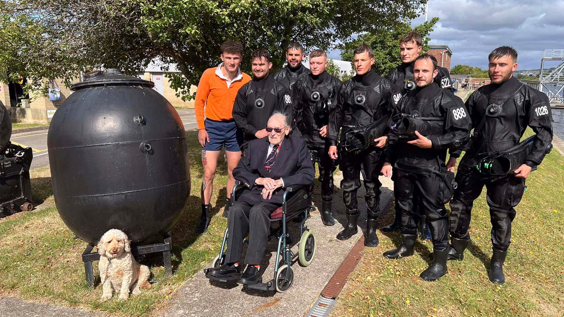 Divers and dog and WW2 bomb disposal expert Boyd Salmon CREDIT ROYAL NAVY