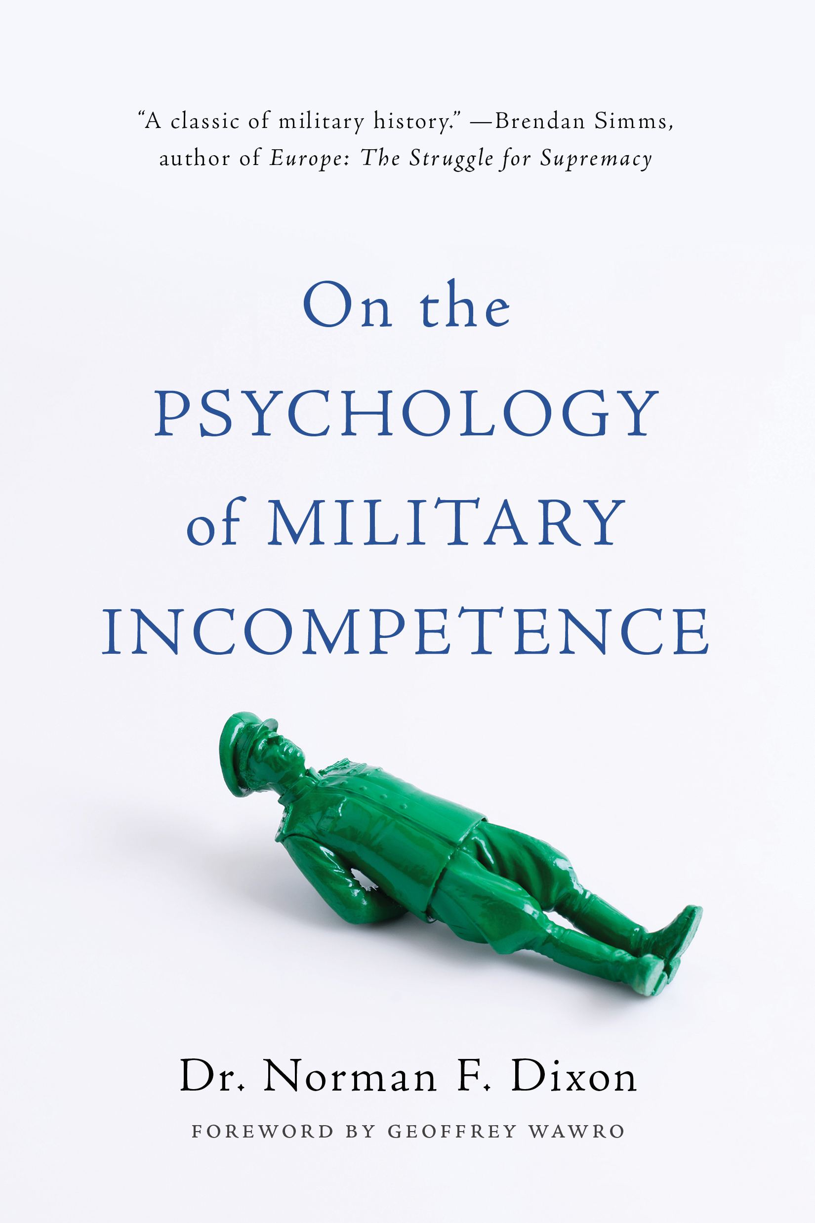 green toy/model soldier lying on the ground