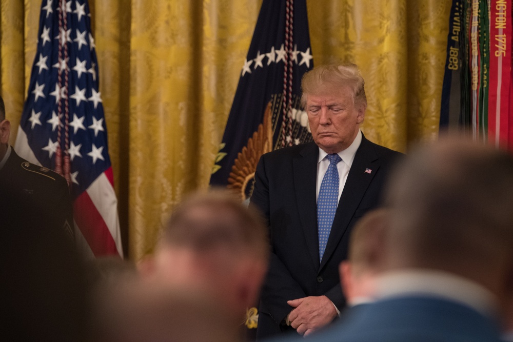 Donald Trump standing with his head bowed 250619 CREDIT US ARMY.jpg