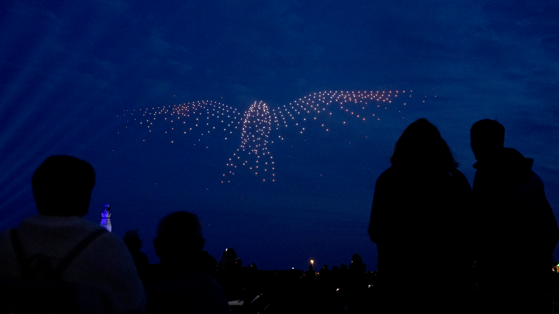 Drones make a bird shape during a drone display telling the story of D-Day above the coastline in Portsmouth 060624