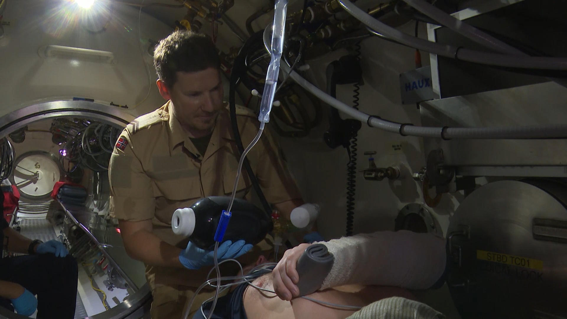 NATO Submarine Rescue Medic treats mock casualty in Ex Dynamic Monarch
