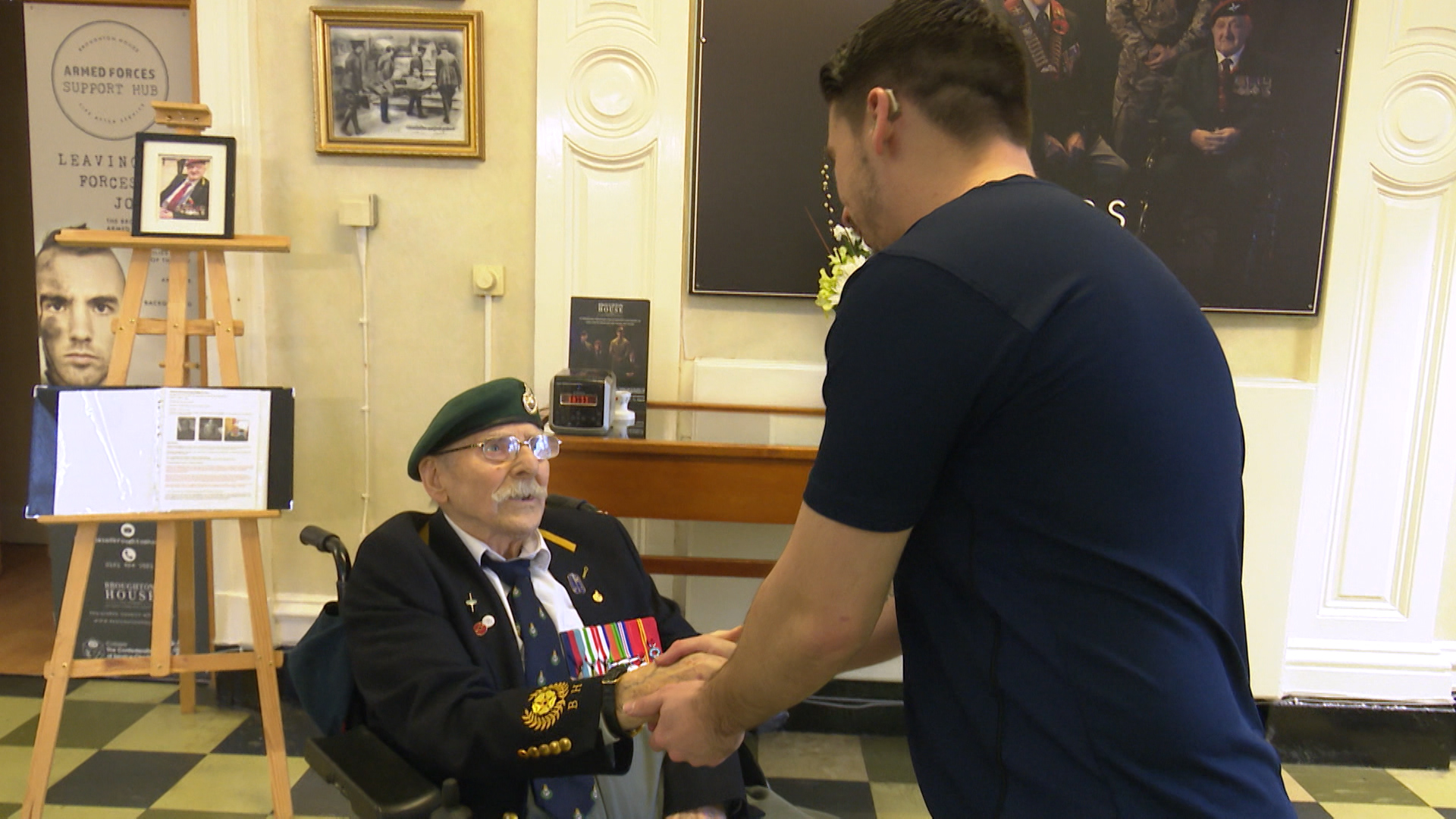 Craig speaks to George Simms - one of the veterans he visits at the care home.