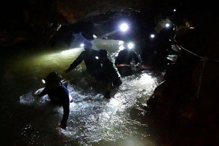 Earlier efforts to pump out water from the cave have been set back every time there has been a heavy downpour (Picture: PA).