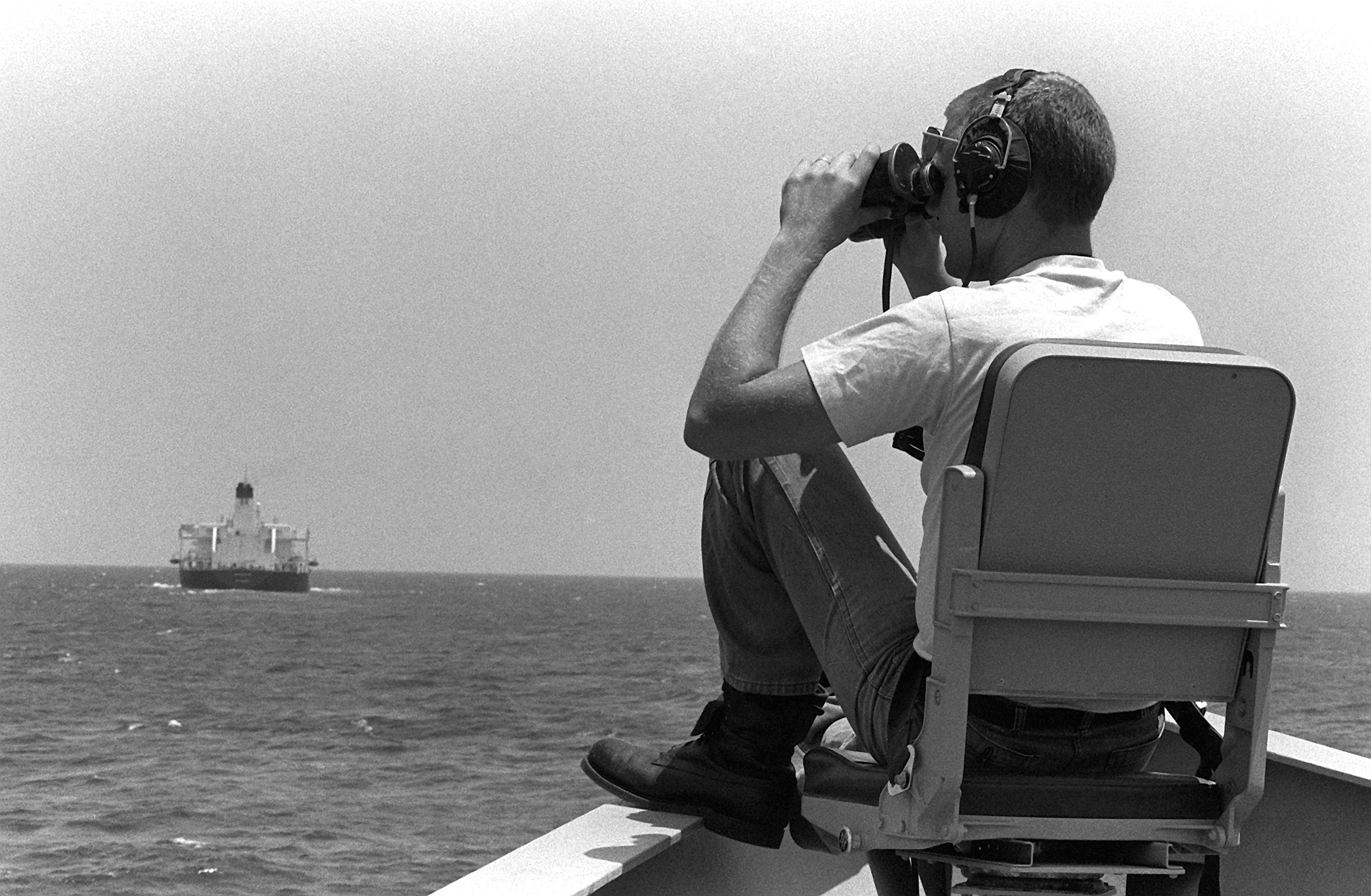 A US sailor on lookout for mines during a convoy support mission. (Image: US Navy)