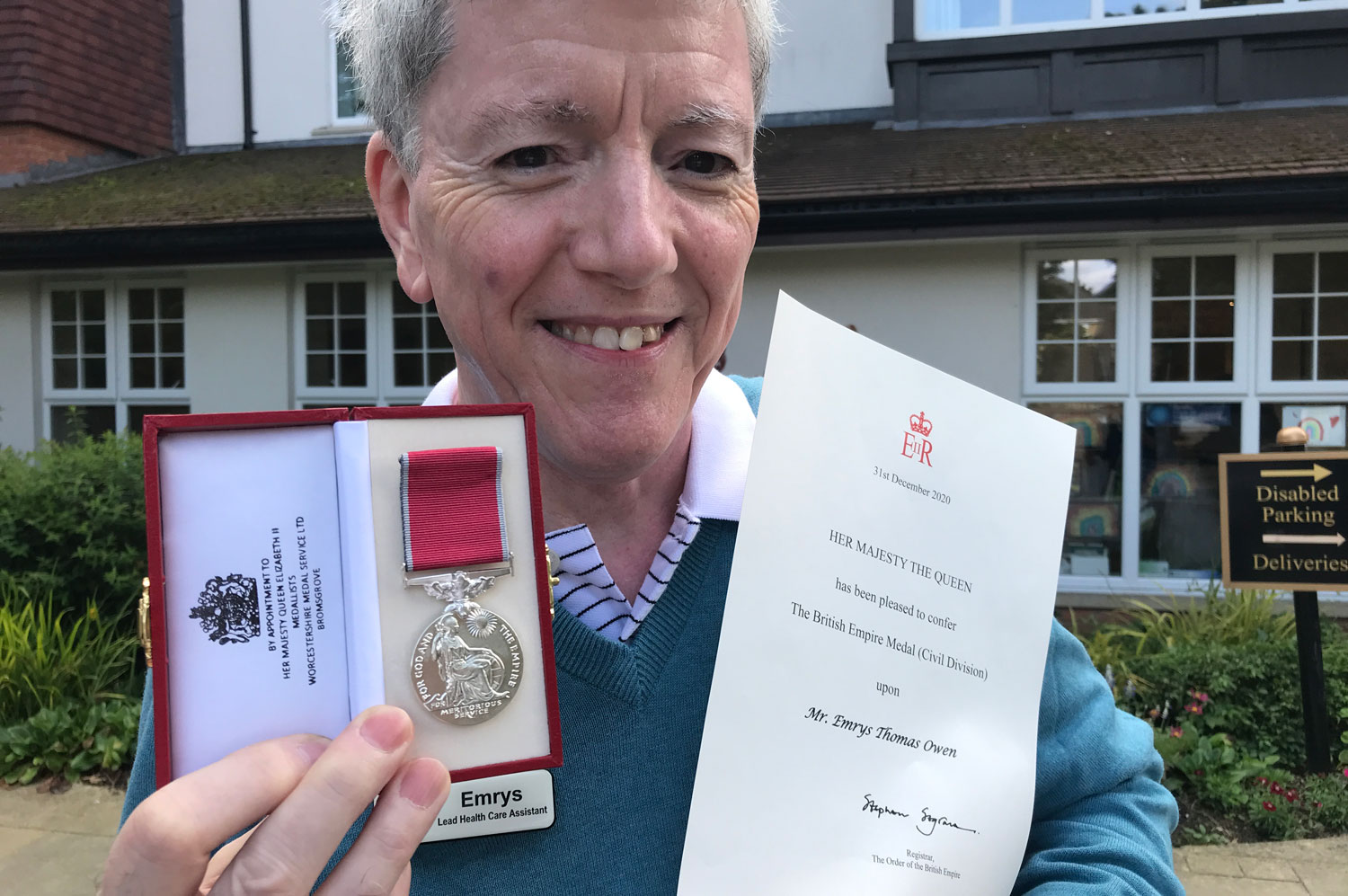 Emrys Owen holds his British Empire Medal BEM (Picture: Royal Star & Garter)
