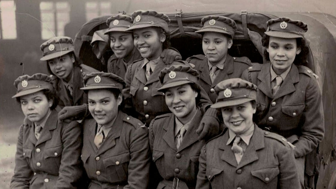 A group of West Indian girls arriving at camp in an Army car Credit: Ena Collymore-Woodstock's family
