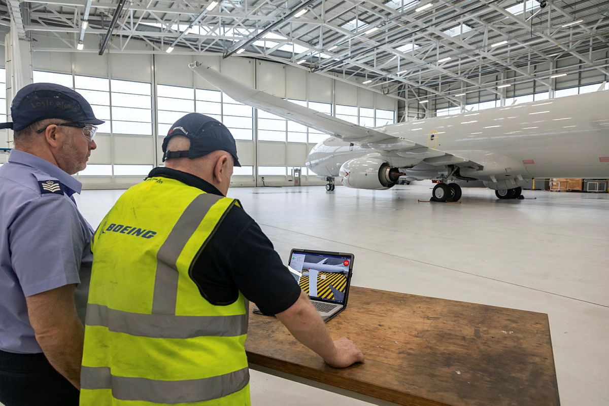 Engineers learning how to use a drone to examine the exterior of an aircraft as part of a project started at RAF Lossiemouth (Picture: MOD).