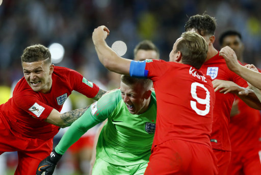 England players jubilant after their first ever World Cup penalty shootout win (Picture: PA).