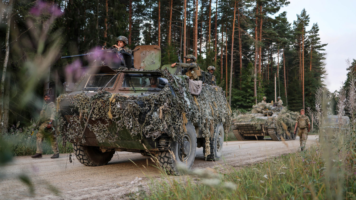 A French VAB VTT Armoured personnel carrier, followed by a British Warrior during Exercise Dragon Charge in Estonia 16-17 August 2022 CREDIT Crown Copyright