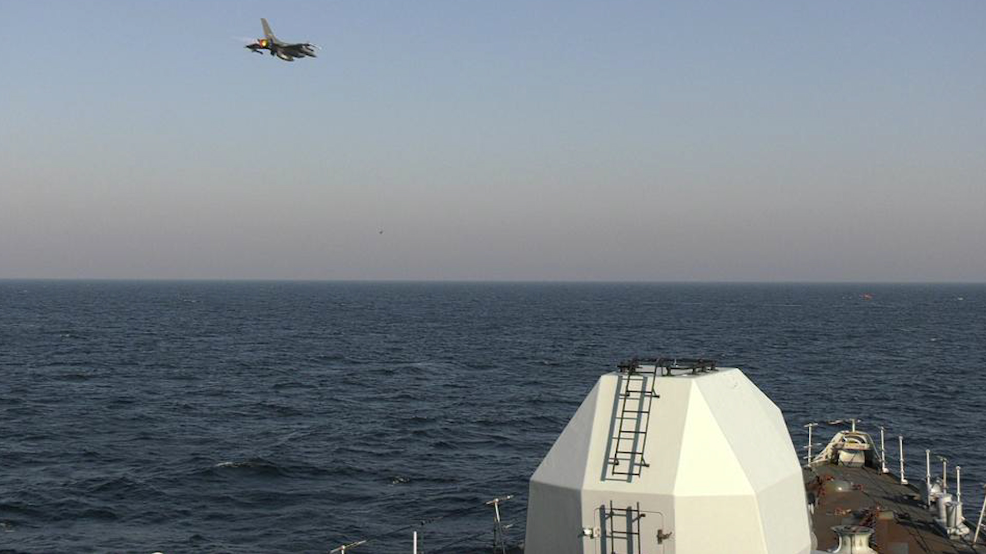 F-16 aircraft flying during Air Maritime Integration operations between the HMS Richmond and the Danish Navy 