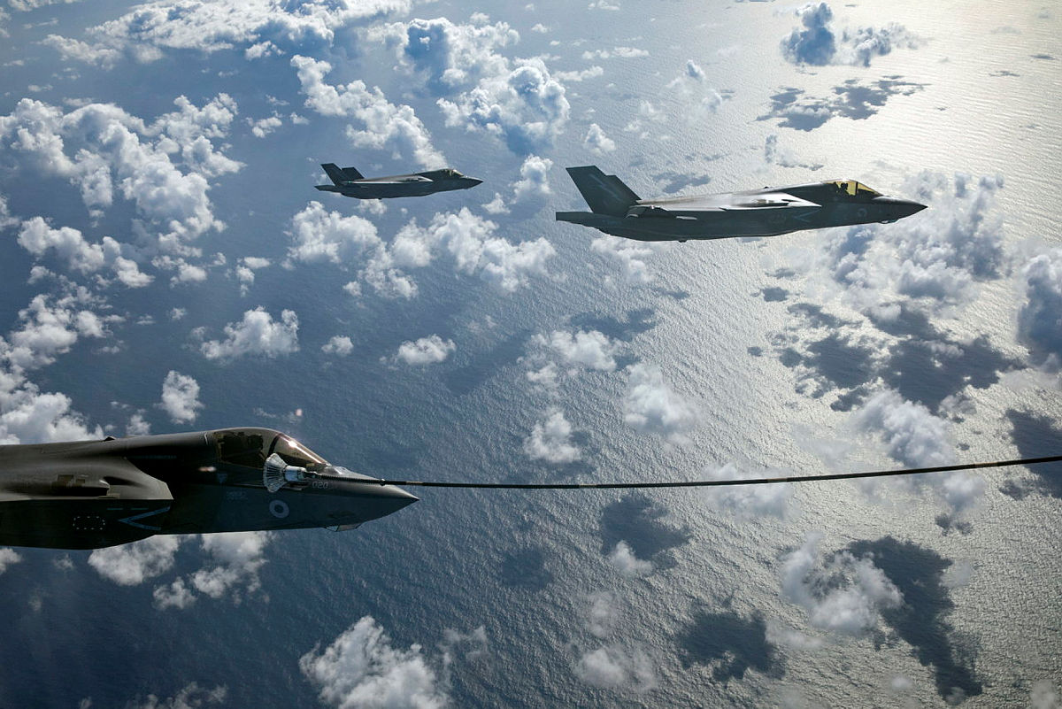 F-35B Lightnings of 617 Squadron with one shown doing mid-air refuelling