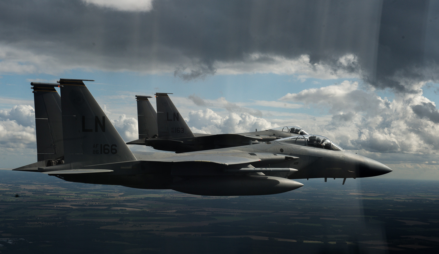 Two 48th Fighter Wing F-15C Eagles, based at RAF Lakenheath, fly over UK