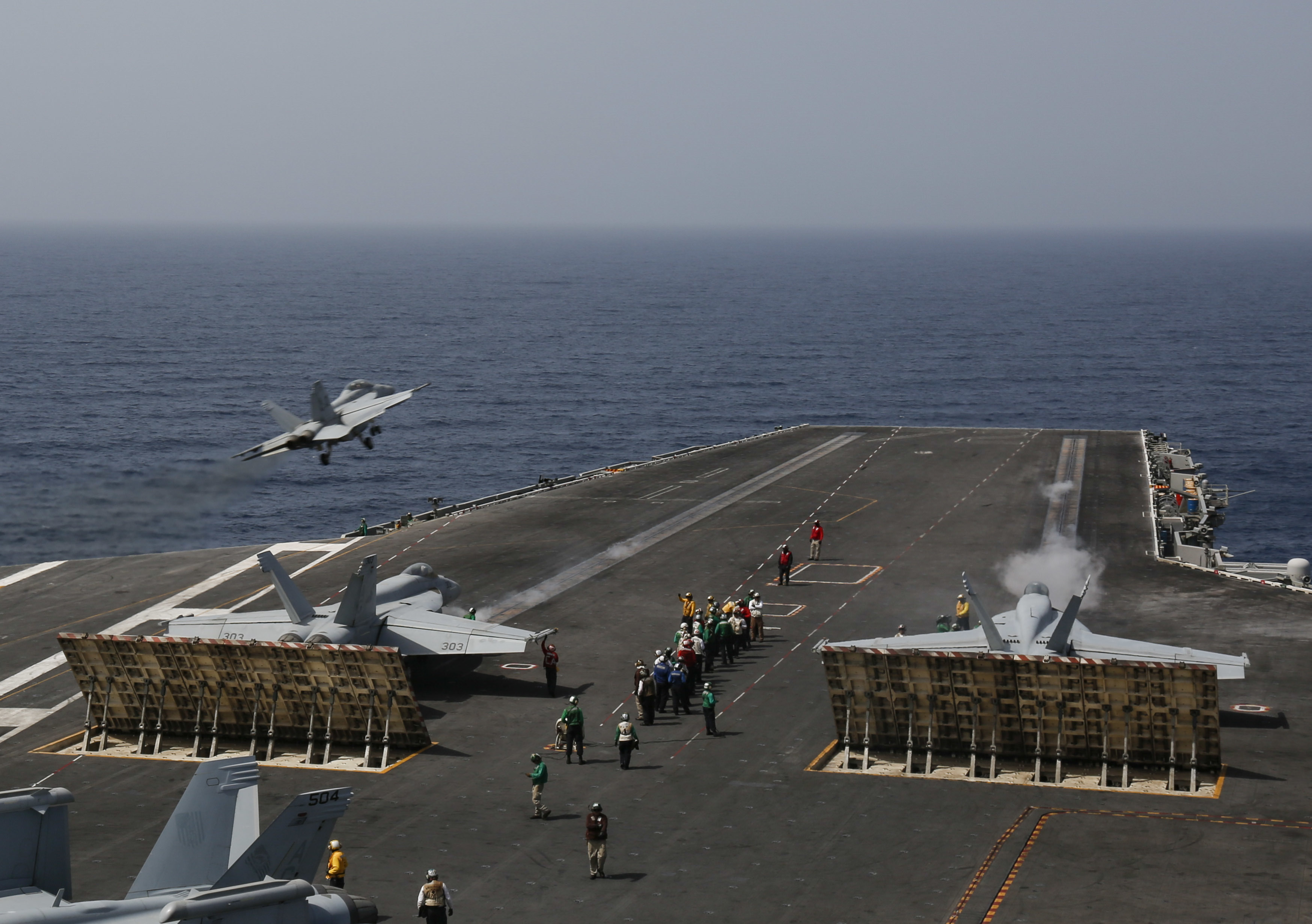 F/A-18E Super Hornets prepare to launch from the flight deck of USS Abraham Lincoln which has deployed to the region (Picture: US Department of Defense).