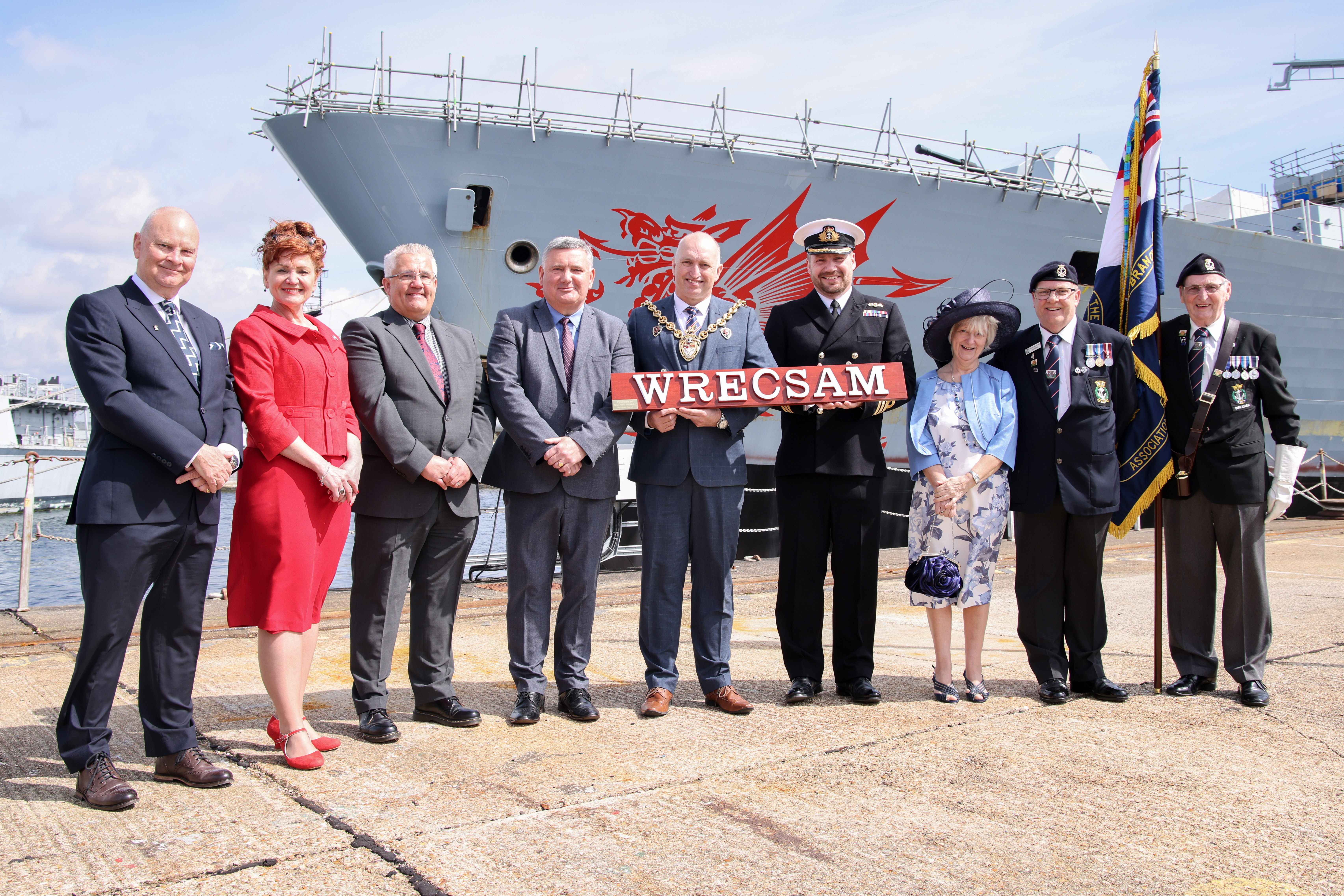 Officials gather alongside HMS Dragon to formally mark the ship's affiliation with Wrexham (Credit: MOD).