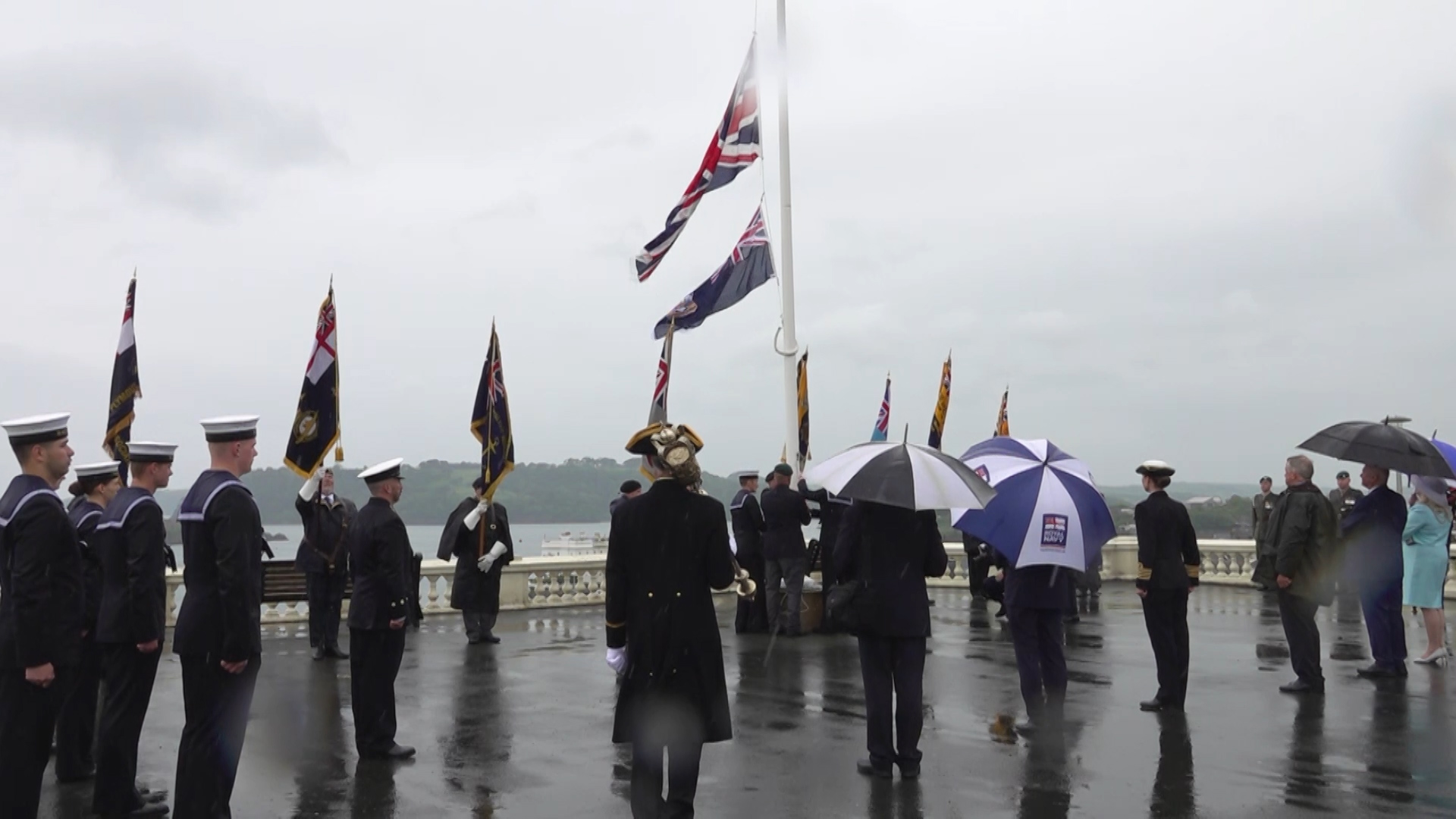 Falkland Islands flag being raised alongside the Union Jack in Plymouth