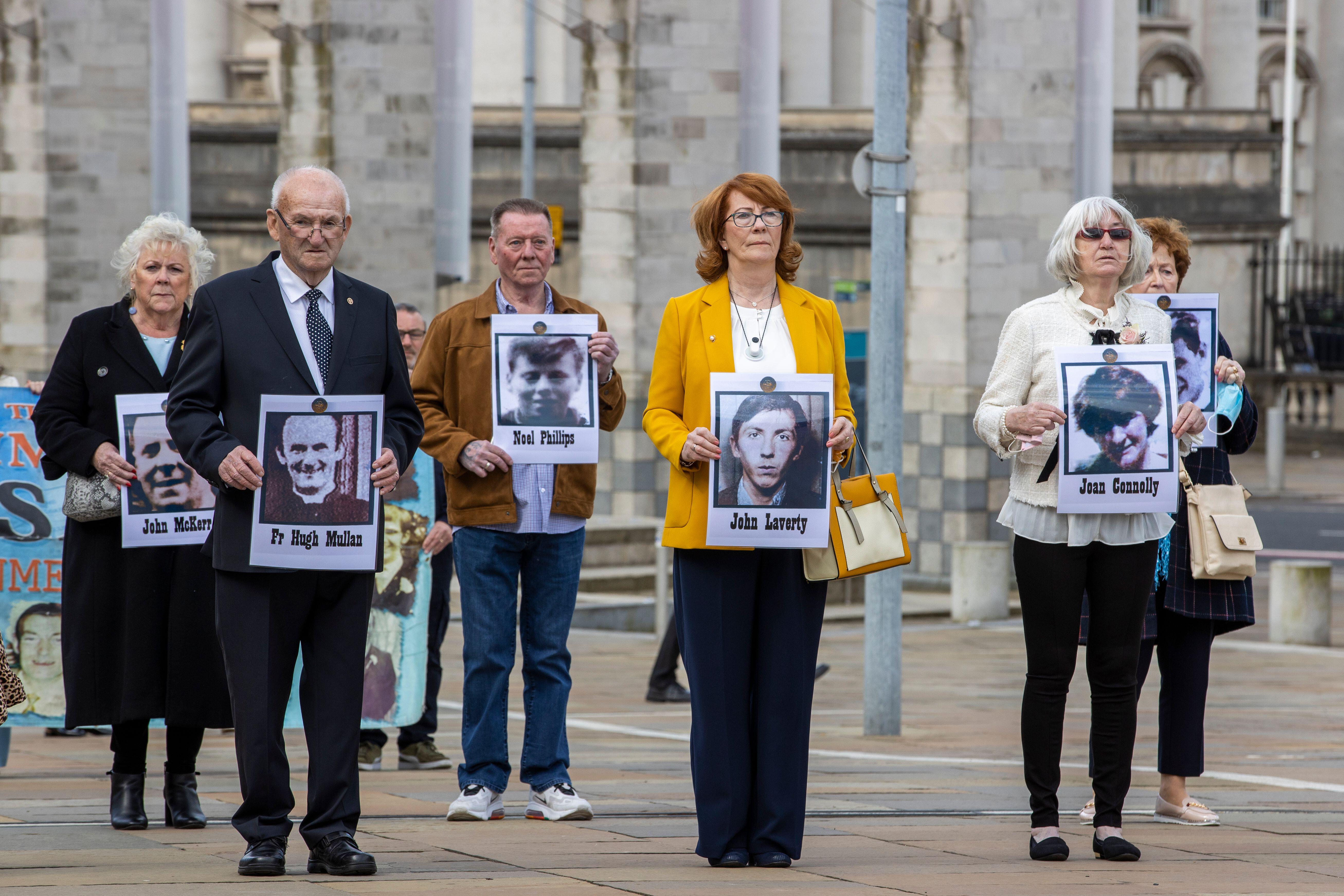 Cover image: Families of the people killed at Ballymurphy in 1971 held their pictures outside the court (Picture: PA/Alamy).