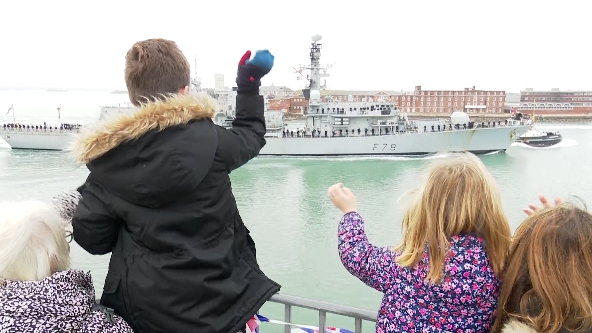 Families wave to HMS Kent as it returns to Portsmouth from the CSG deployment 021222 CREDIT BFBS.jpg
