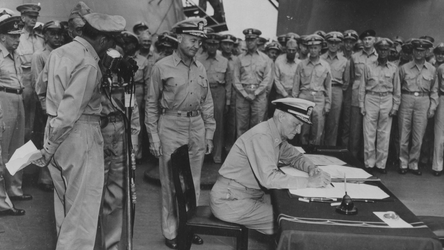 Fleet Admiral Chester W Nimitz signs for the US during the surrender ceremony on the USS Missouri in Tokyo Bay, 31 Aug 45 CREDIT National Archives and Records 