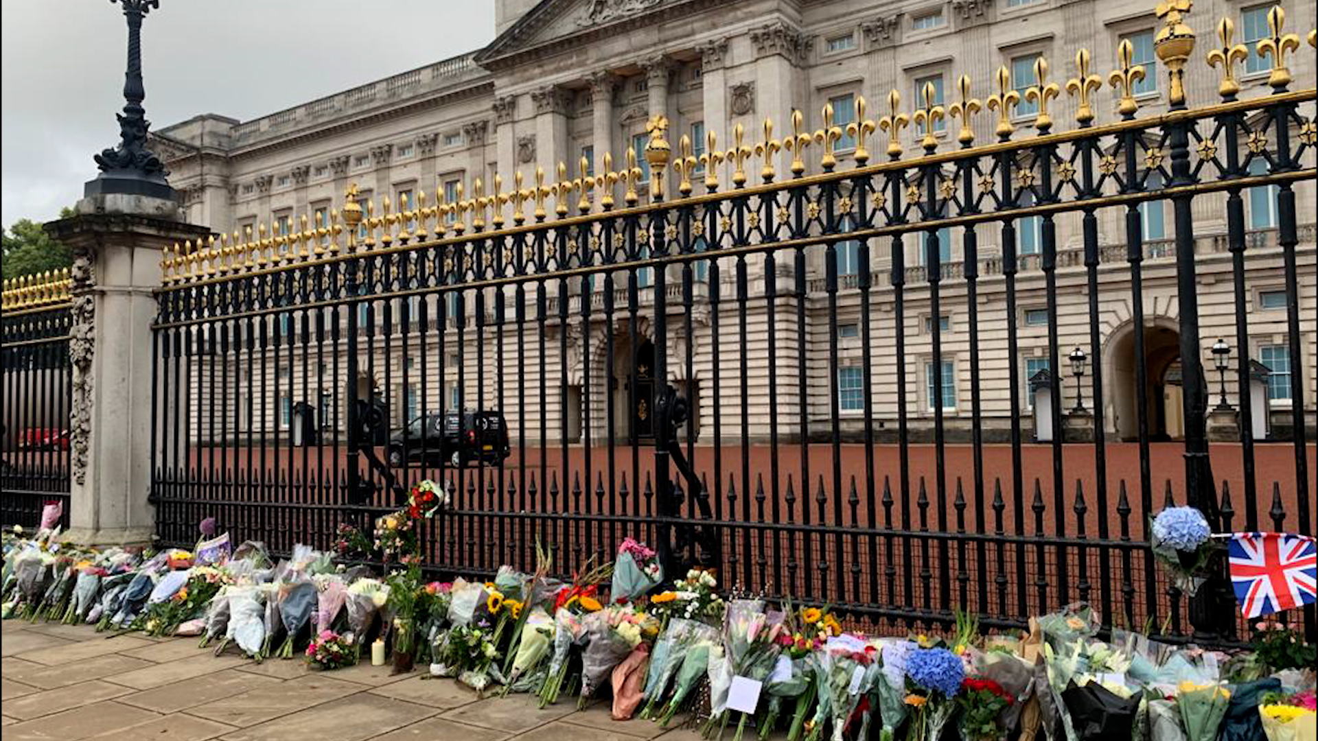 Flowers laid by those mourning the death of Queen Elizabeth II outside Buckingham Palace.