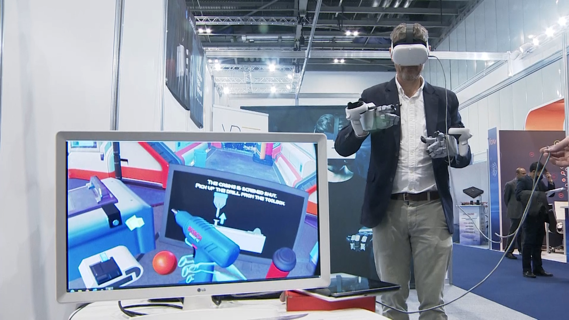 Reporter Simon Newton tried on a VR headset and gloves that allow to feel virtual objects.